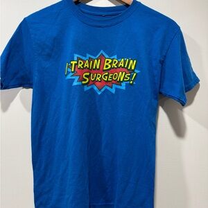 Blue “I Train Brain Surgeons!” Graphic T-Shirt
